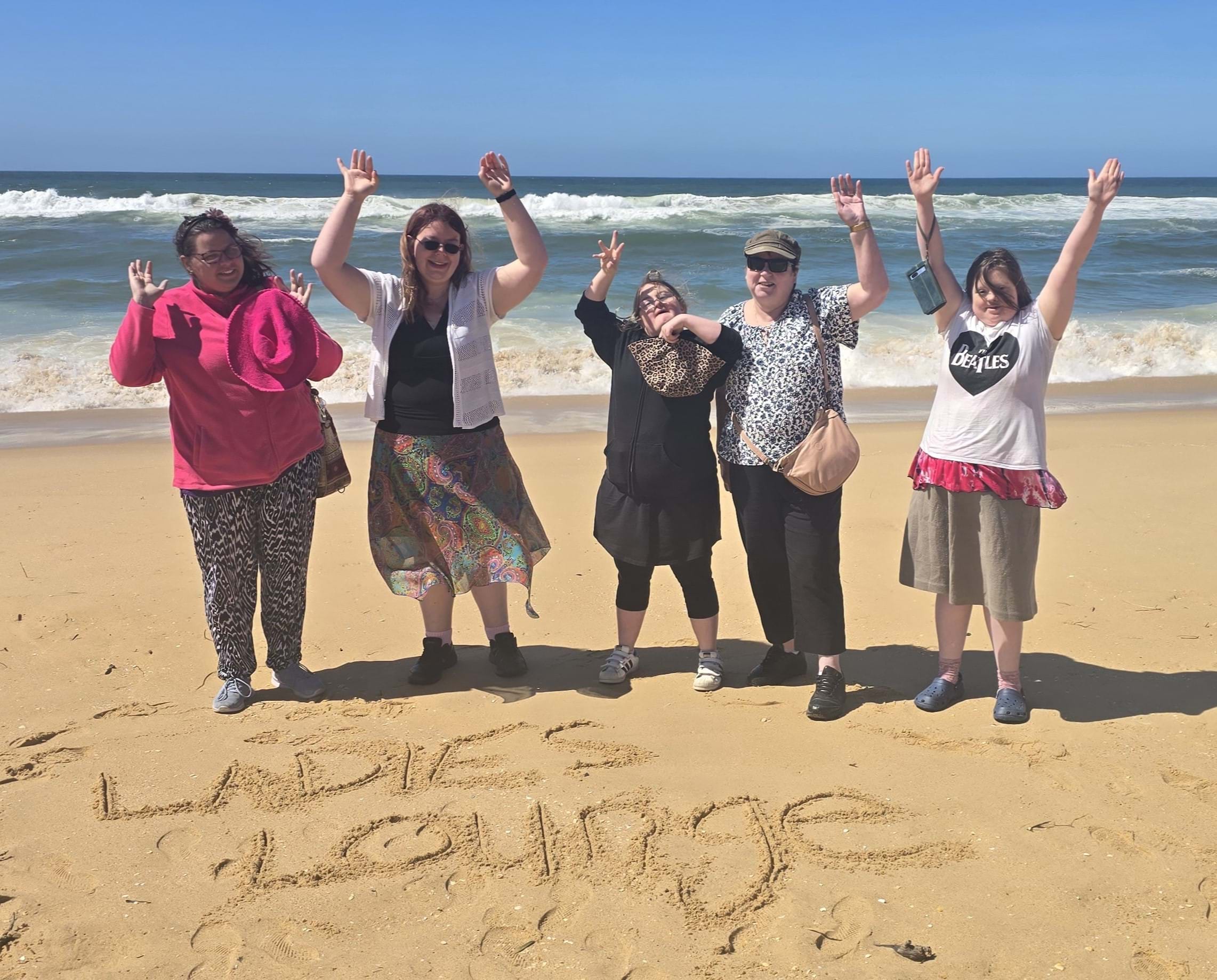 Distinctive Options Ladies Lounge group enjoy a day at the beach