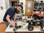 a man showing remote control car and other remote control cars on table Disability supports Bairnsdale