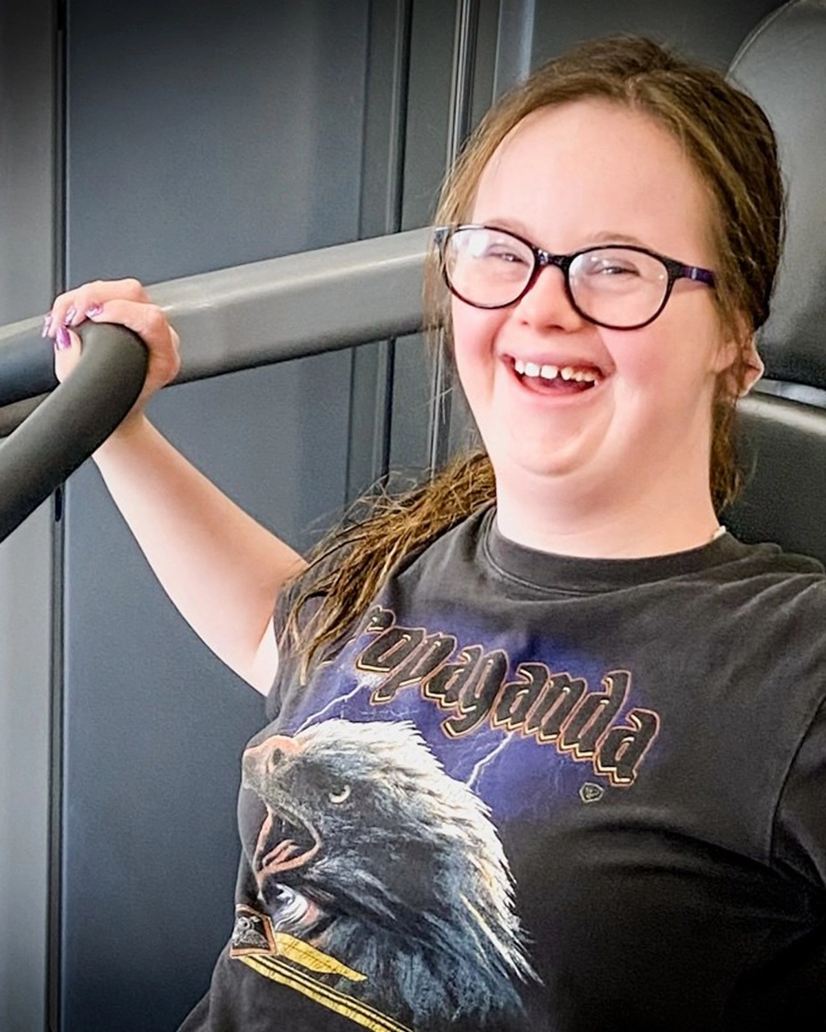 A woman lifts weights at a gym at NDIS registered disability provider Distinctive Options