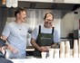 Kevin and Peter behind the counter at the DO Food Project Mobile Trailer