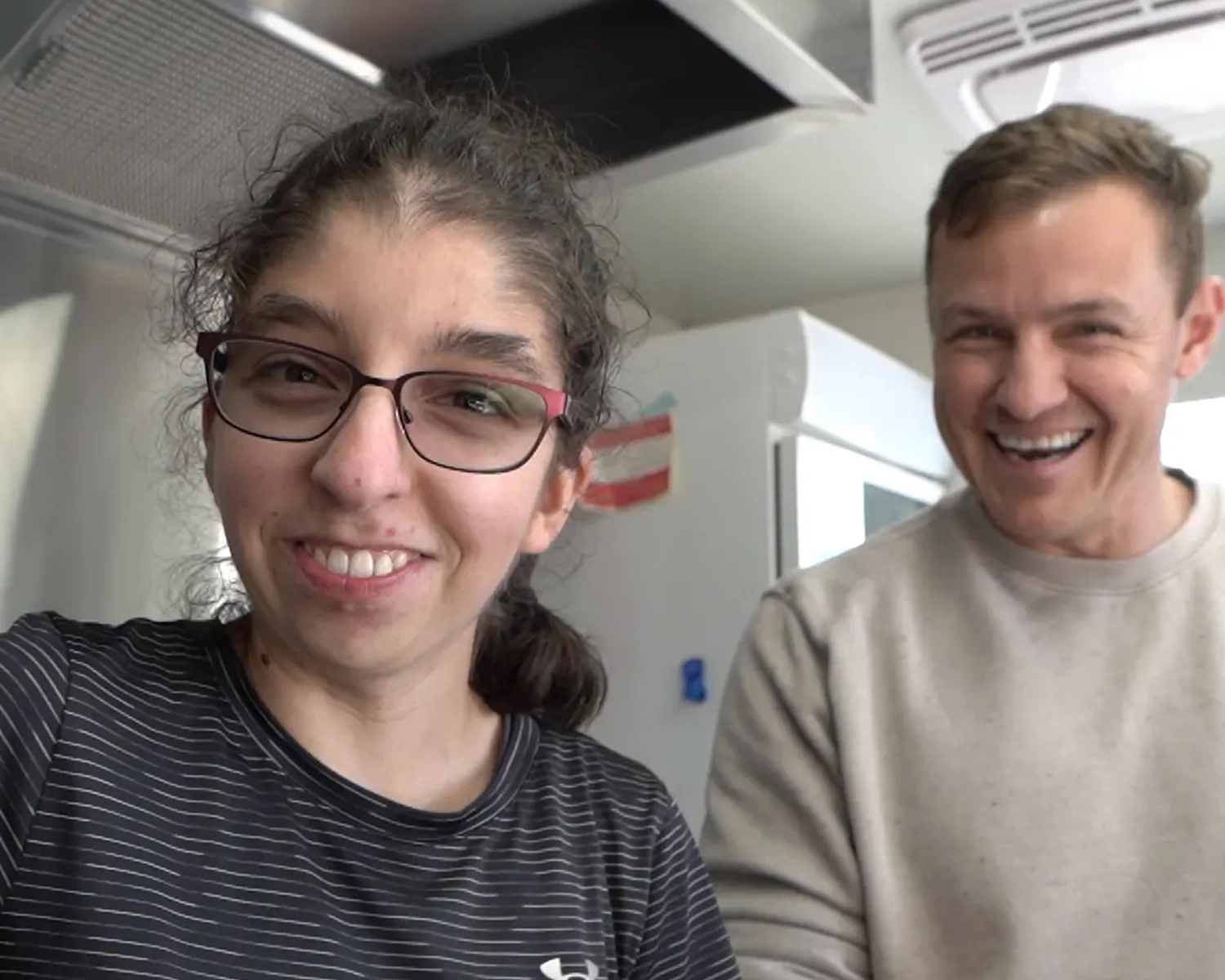 Two people stand in a food van at NDIS registered disability service Distinctive Options
