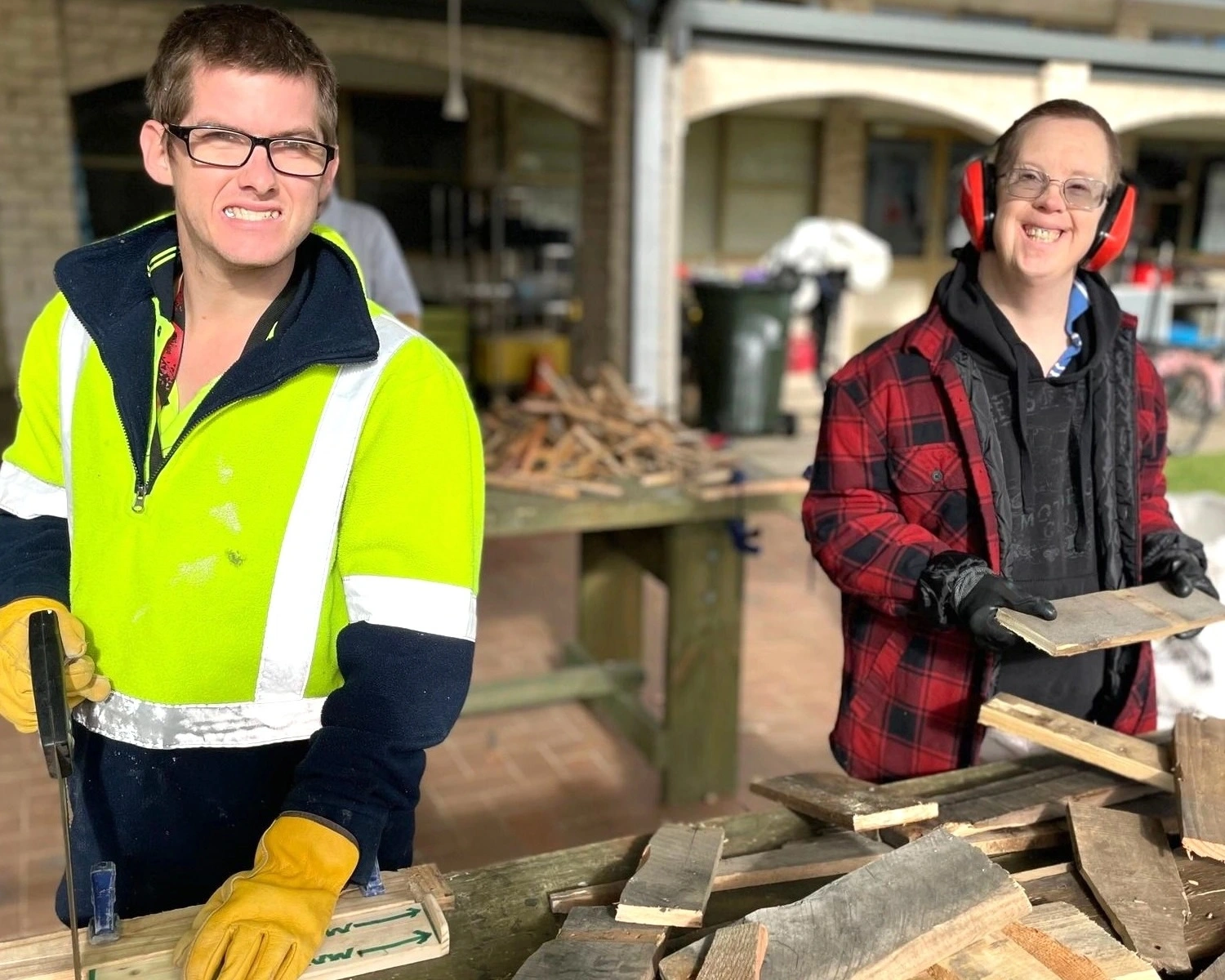 Two men do woodwork activities at Distinctive Options group activities in Bairnsdale