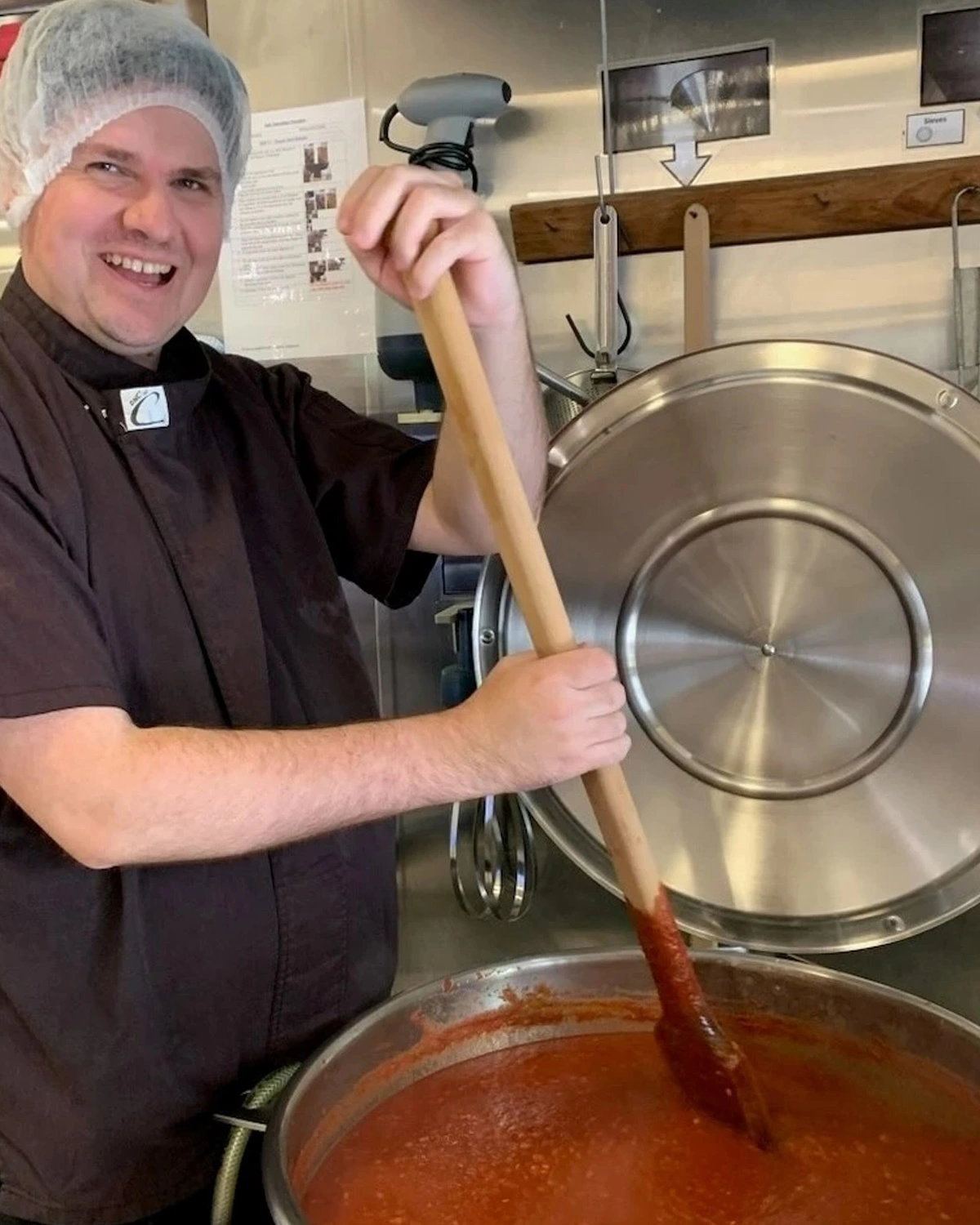 stirring pot of chutney at banksia fine food social enterprise at NDIS registered disability support Distinctive Options